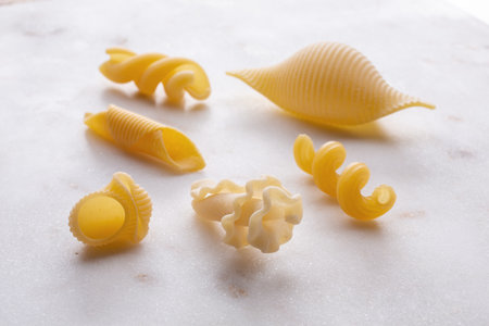 Different types of pasta on a white background. Close up.の写真素材