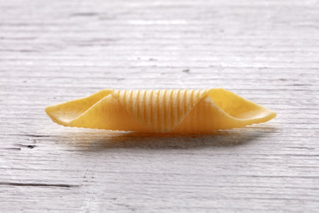 Pasta on white wooden table, close-up, horizontal viewの写真素材