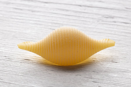 close up of a conchiglie pasta on a wooden backgroundの写真素材