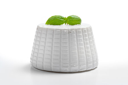 ricotta cheese with basil on a white background. Isolated.の写真素材