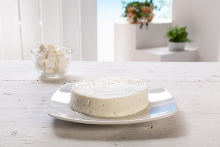Primo sale cheese on a white plate on a white wooden tableの写真素材