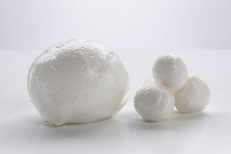 Mozzarella cheese balls on a white background. Selective focus.の写真素材