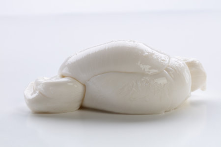 Fresh mozzarella cheese on a white background, close-upの写真素材
