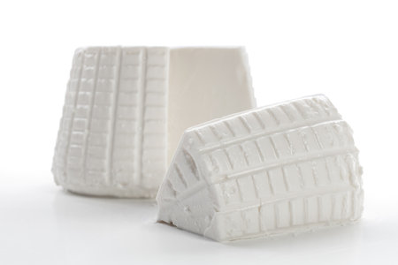 White ricotta cheese isolated on white background. close up. studio shot.の写真素材