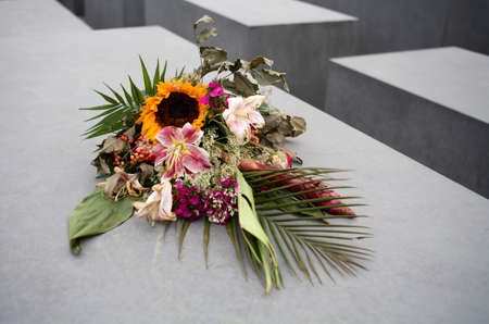 holocaust memorial berlin with bouquet of flowersのeditorial素材