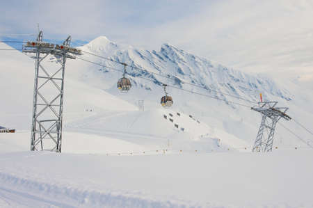 Grindelwald, Switzerland - March 07, 2009: Cable car gondolas move skiers uphill at the ski resort in Grindelwald, Switzerland.のeditorial素材