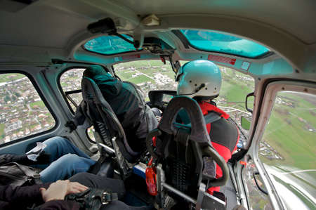 Interlaken, Switzerland, December 08, 2009 - Tourists enjoy helicopter sightseeing trip in Bernese Oberland in Interlaken, Switzerland.のeditorial素材