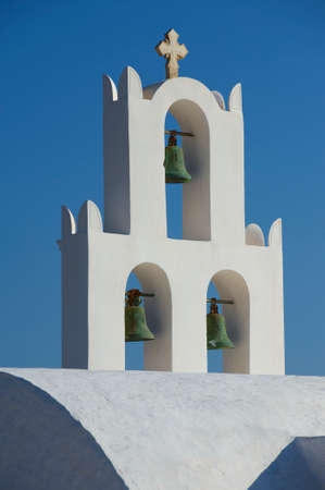 Small church bell tower at Santorini island, Greece.の写真素材
