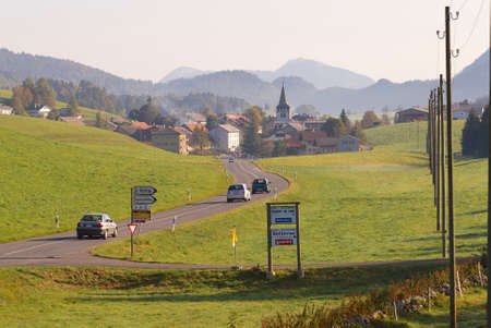 Circa Affoltern Im Emmental, Switzerland, September 22, 2007 - Cars pass by a countryside road circa Affoltern im Emmental, Switzerland.のeditorial素材