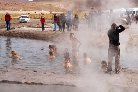 Circa San Pedro De Atacama, Chile, October 25, 2013 - People bathe in thermal water of the El Tatio geysers circa San Pedro de Atacama, Chile.のeditorial素材