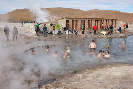 Circa San Pedro De Atacama, Chile, October 25, 2013 - People bathe in thermal water of the El Tatio geysers circa San Pedro de Atacama, Chile.のeditorial素材