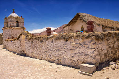 Exterior of the beautiful Parinacota village church located circa Putre, Chile. Parinacota church was built in the 17th century of stone and clay, located 4,400 meters AMSL in Lauca National Park, Chile.の写真素材