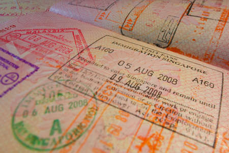 Passport page with Singapore immigration control stamps.のeditorial素材