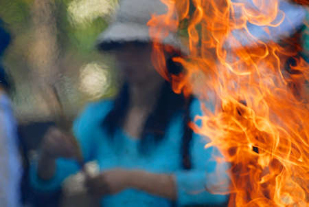Ho Chi Minh, Vietnam, February 17, 2007 - Woman burns incense and prays at the Buddhist temple during Chinese New Year celebration in Ho Chi Minh, Vietnam.のeditorial素材