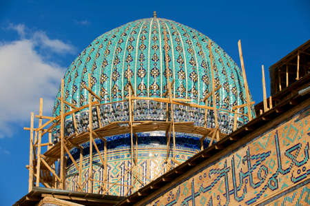 Dome of the beautiful medieval mausoleum of the famous 12th century poet and sufi Khoja Ahmed Yasavi in scaffolding in Turkistan, Kazakhstan.のeditorial素材
