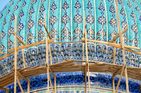 Dome of the beautiful medieval mausoleum of the famous 12th century poet and sufi Khoja Ahmed Yasavi in scaffolding in Turkistan, Kazakhstan. のeditorial素材