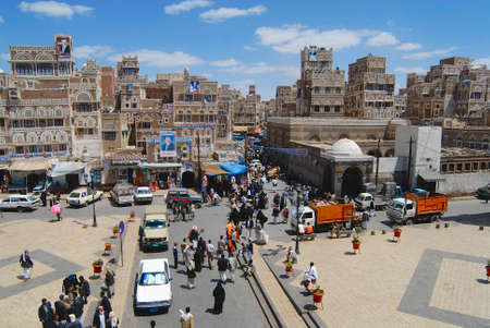 Sanaa, Yemen, September 09, 2006 - People walk by the street of Sanaa city in Sanaa, Yemen. The old city of Sanaa is a UNESCO World heritage site.のeditorial素材