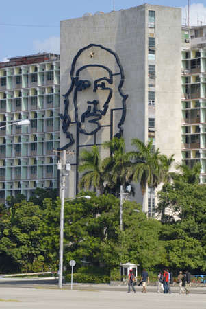 Habana, Cuba, October 21, 2006 - People pass iconic Ministry of Interior Defense building with the portrait of Che Guevara on it\'s facade in Havana, Cuba.のeditorial素材