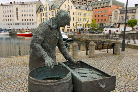 Alesund, Norway - June 03, 2010 : Exterior of the Herring woman sculpture in Alesund, Norway. Fishing (especially herring) industry historically was very important for Alesund.のeditorial素材