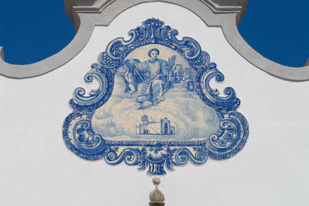 Exterior detail of the Saint Lawrence of Rome church in Almancil, Portugal. Church has one of the most beautiful in Portugal hand painted tiles (Azulejo) of the 18th century at the facade.の写真素材