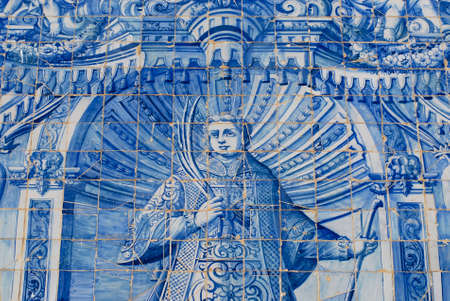 Exterior detail of the Saint Lawrence of Rome church in Almancil, Portugal. Church has one of the most beautiful in Portugal hand painted tiles (Azulejo) of the 18th century at the facade. This azulejo tiles depict Saint Lawrence of Rome.の写真素材