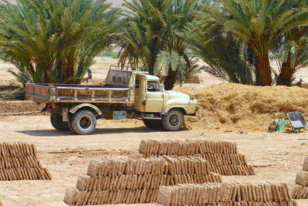 Shibam, Yemen - September 12, 2006 : Ready to load truck parked at the mud brick factory in Shibam, Yemen. Mud bricks is a traditional construction material in Hadramaut valley, Yemen.のeditorial素材