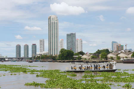 Bangkok, Thailand, May 21, 2009 - People cross Chao Phraya river by ferry boat in Bangkok, Thailand.のeditorial素材