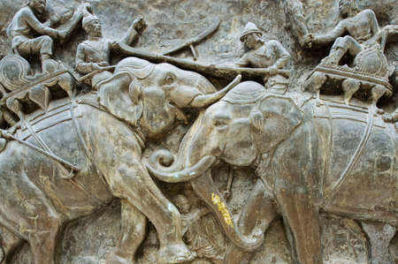 Suphan Buri, Thailand - Au, 2011 : Exterior detail of the Don Chedi monument bas-relief in Suphan Buri, Thailand. The royal monument of King Naresuan the Great and the pagoda were built to commemorate the victory over the Burmese troops.のeditorial素材