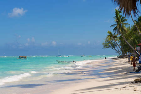 Punto Cana, Dominican Republic, November 02, 2012 - People walk by the tropical beach in Punto Cana, Dominican Republic.のeditorial素材