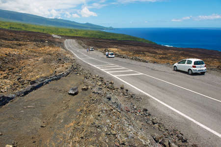 Sainte-Rose De La Reunion, France, December 06, 2010 - People enjoy the view to the asphalt road over volcanic lava in Sainte-Rose De La Reunion, France.のeditorial素材