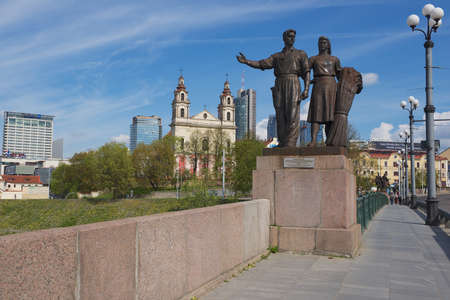 Vilnius Lithuania  May 04 2015 : Exterior of the bronze sculpture of worker and farm woman in Soviet Realism style at the Green Bridge in Vilnius Lithuania.のeditorial素材