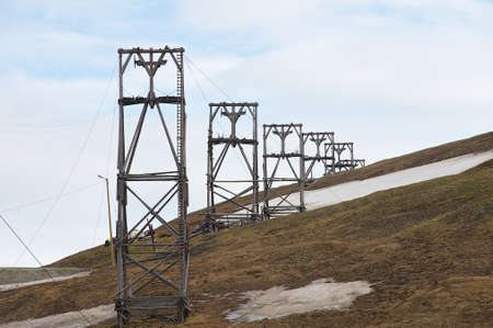 View to the abandoned arctic coal mine equipment in Longyearbyen Norway. This unique equipment was used for coal transportation from mines to the sea port using gravitation force only.の写真素材