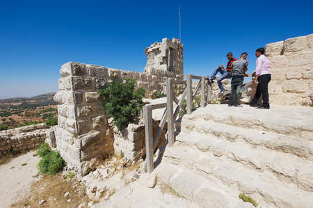 Ajlun, Jordan, August 19, 2012 - People visit Ajloun fortress in Ajloun, Jordan. This ayyubid castle was built in the 12th century, used by crusaders and arabs.のeditorial素材