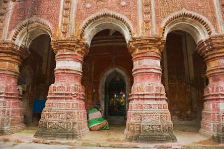 Puthia, Bangladesh, February 16, 2014 - Woman prays at the Pancharatna Govinda Hindu temple in Puthia, Bangladesh.のeditorial素材