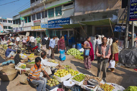 Bandarban, Bangladesh, February 20, 2014 - People walk by the local market in Bandarban, Bangladesh. The most remoted and least populated in the country Bandarban area became one of the most exotic tourist destination of Bangladesh after insurgency in theのeditorial素材