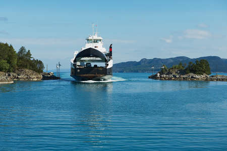 Tveit, Norway - June 06, 2010: Ferry boatz arrives to the port in Tveit, Norway.のeditorial素材