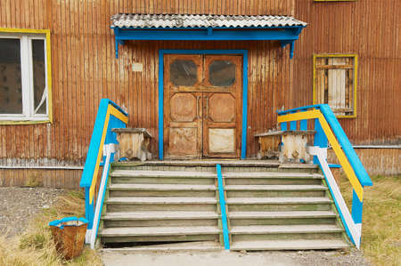 Pyramiden, Norway - September 03, 2011: Exterior of the deserted building entrance at the abandoned Russian arctic settlement Pyramiden, Norway.のeditorial素材