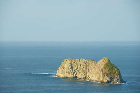 Cliff in the sea near the Pacific coast of Quepos in Costa Rica.の写真素材