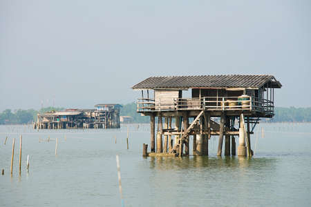 View to the stilt fishermen cabin in the gulf in Tha Thong, Surat Thani province, Thailand.の写真素材