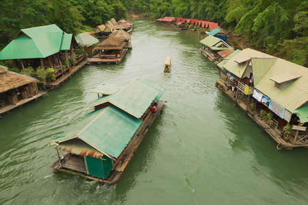 Suphan Buri, Thailand - August 18, 2011: View to the traditional thai village at the river bank in Suphan Buri, Thailand.のeditorial素材