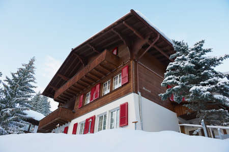 Murren, Switzerland - December 08, 2009: Exterior of the traditional wooden chalet Meierisu in Murren, Switzerland. Murren is a famous car-free ski resort in Switzerland.のeditorial素材