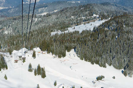 Lucern, Switzerland - February 21, 2012: View to the forest at the slope of the Pilatus mountain from the cable car gondola in Lucern, Switzerland.のeditorial素材