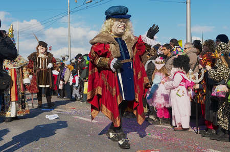 Lucerne, Switzerland, February 20, 2012 - People take part in the parade at Lucerne carnival in Lucerne, Switzerland.のeditorial素材
