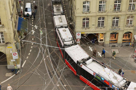 Bern, Switzerland - February 23, 2012: View from the Clock Tower to the tram passing by the street...