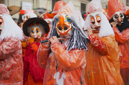 Basel, Switzerland, March 02, 2009 - Women play flutes at Basel Carnival in Basel, Switzerland.のeditorial素材