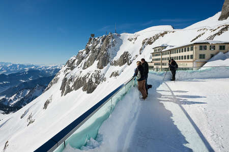 Lucern, Switzerland, February 21, 2012 - People enjoy the mountain view from the terrace on top of...
