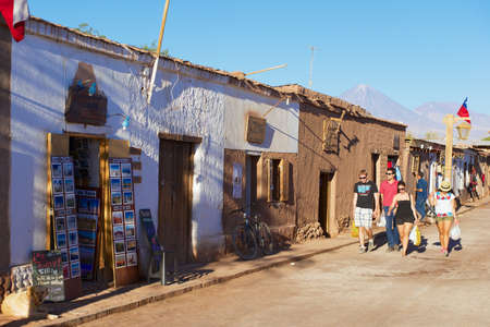 San Pedro De Atacama, Chile, October 23, 2013 - Tourists walk by the street of the town of San Pedro de Atacama, Chile.のeditorial素材