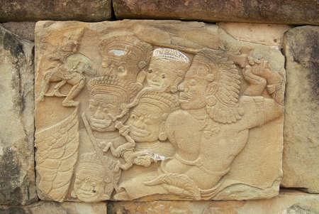 Siem Reap, Cambodia - August 10, 2008: Exterior of the ancient bas-relief at the wall of the Bakong temple in Siem Reap, Cambodia.のeditorial素材