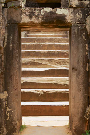 Siem Reap, Cambodia - August 10, 2008: View to the old staircase in the Bakong temple in Siem Reap, Cambodia.のeditorial素材