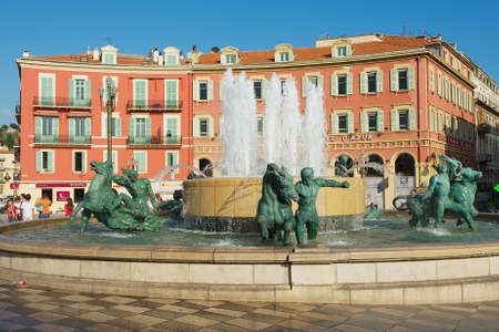 Nice, France - July 21, 2009: View to the Fontaine du Soleil at the Place Massena square on a hot day in Nice, France. Place Massena is the main public square in Nice.のeditorial素材